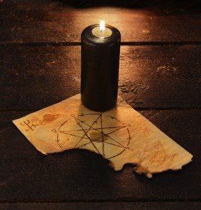 Black candle with pentagram