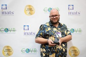 Publicist Jake-Ryan accepting a COVR Award